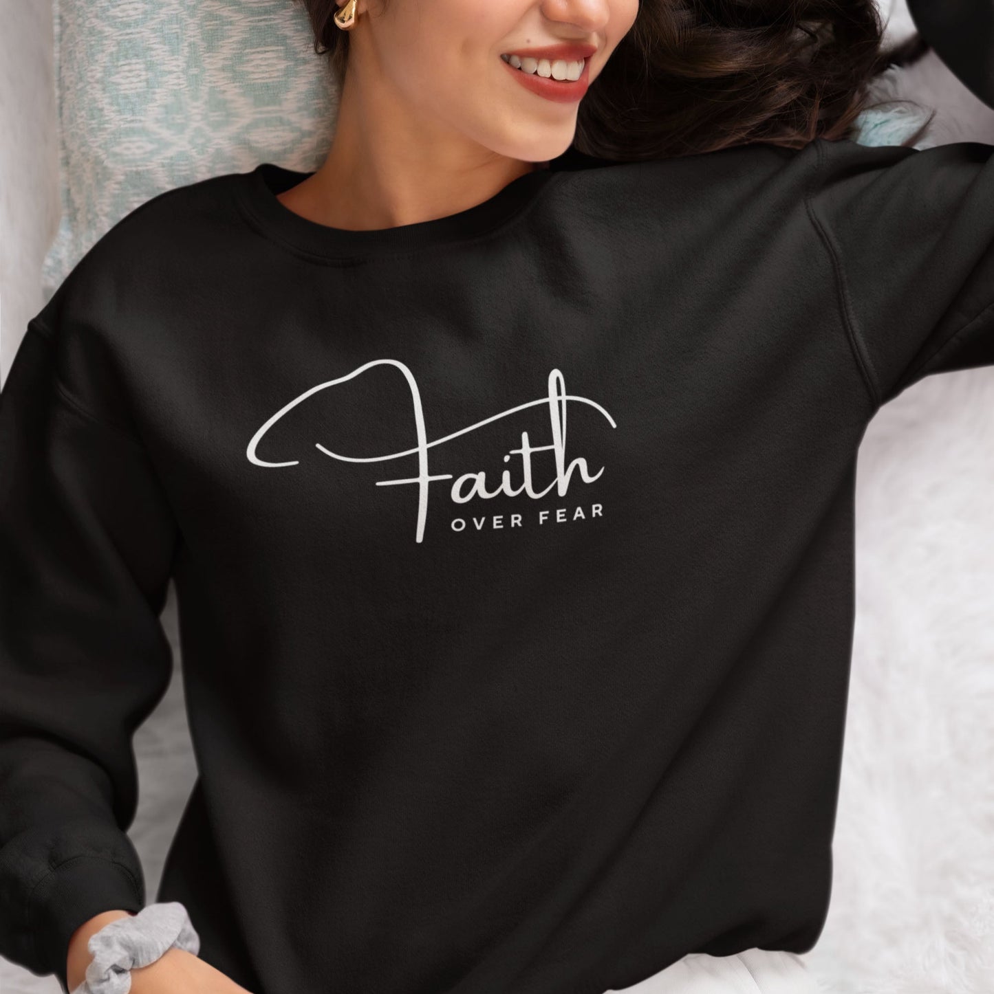 Woman wearing "Faith Over Fear" sweatshirt in Military Green