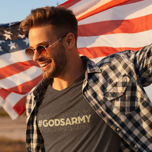 Man wearing a '#GODSARMY' t-shirt with an American flag in the background