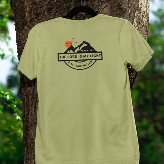 Green t-shirt with a graphic design hanging on a tree