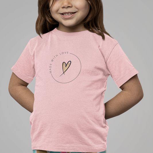 Child wearing a pink t-shirt with a heart design and colorful leggings on a gray background